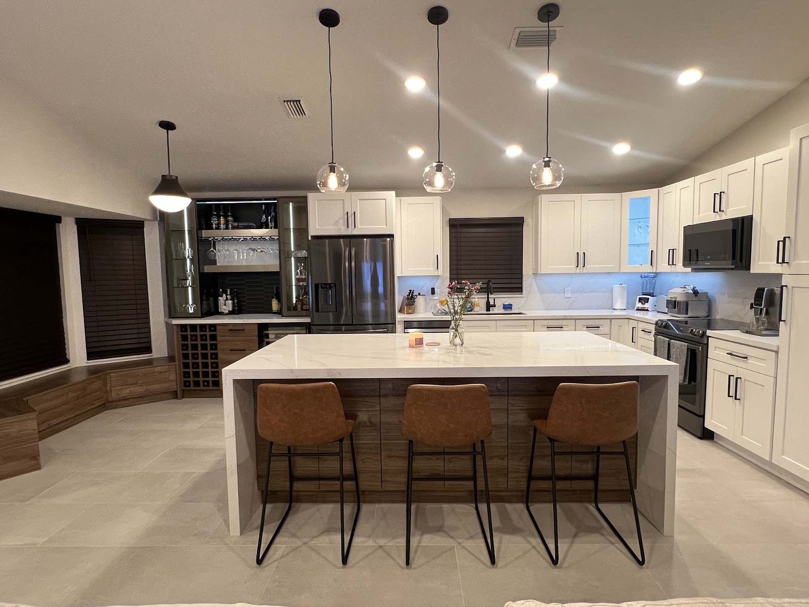 Modern Kitchen with two waterfall island, flat door cabinets, and Calacatta Izaro for the countertops. 