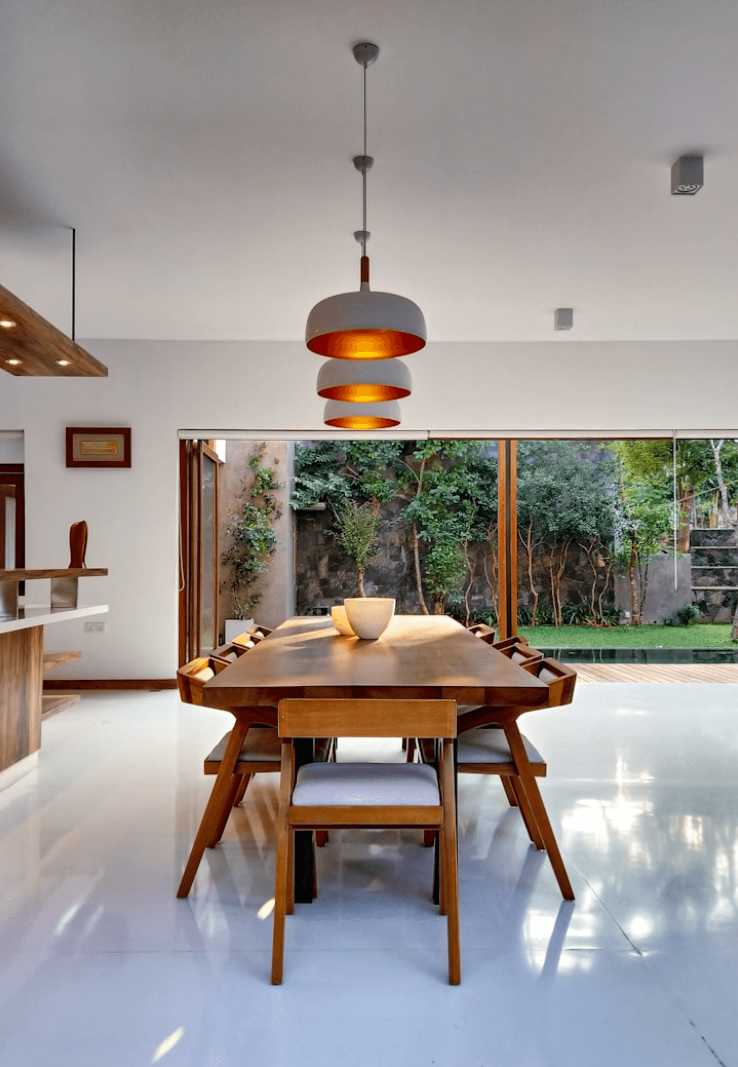 A room with a big window that opens up to the outside