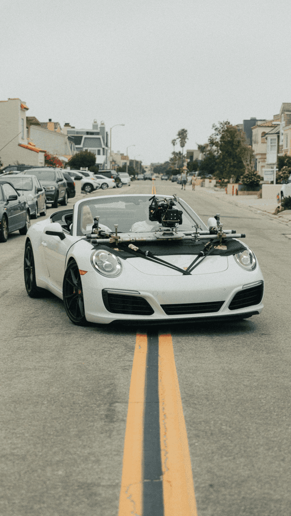 white porsche 911 on road during daytime