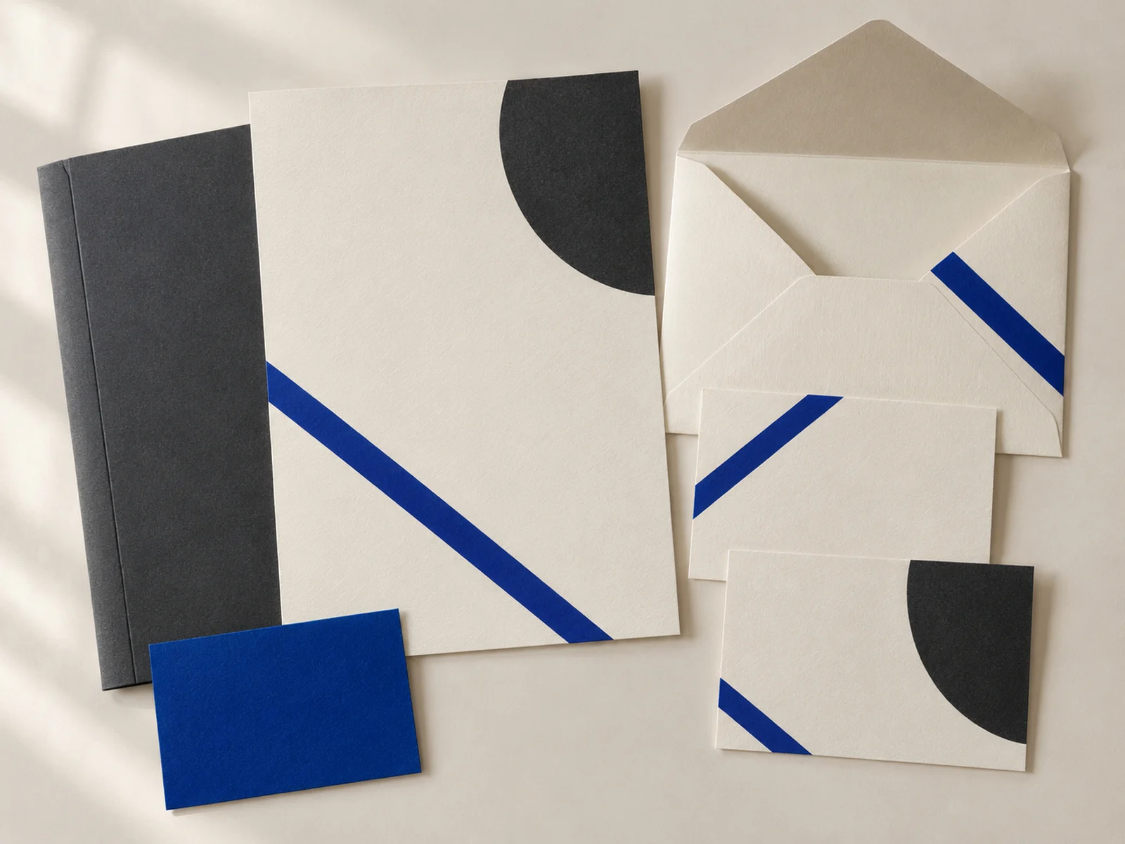 Harbor stationery with diagonal cobalt lines on cream paper