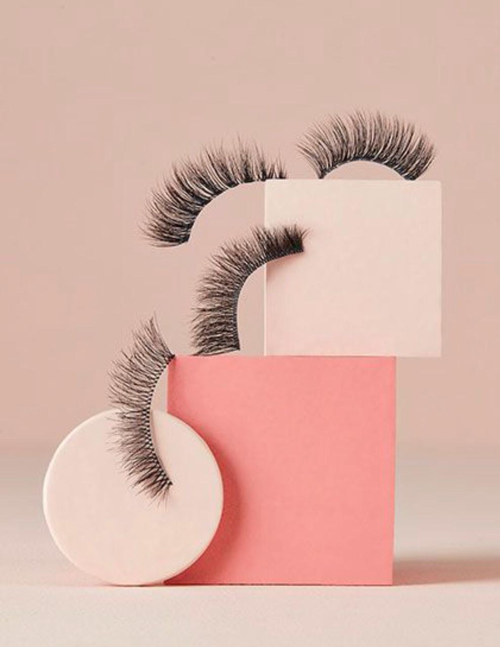 person opening notebook on brown wooden table