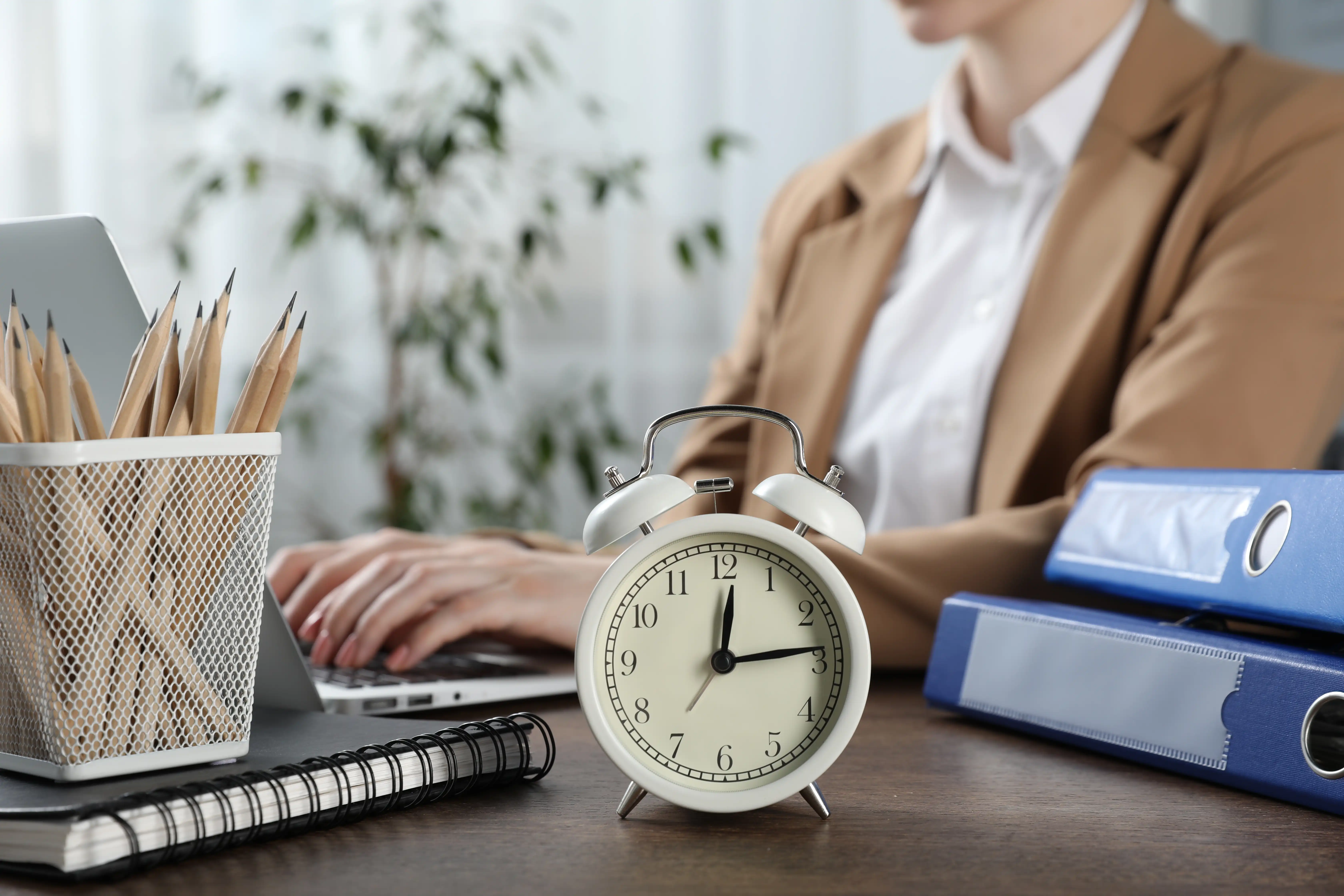 Alarm clock on an office desk symbolizing statute of limitations deadlines for California wage and hour claims