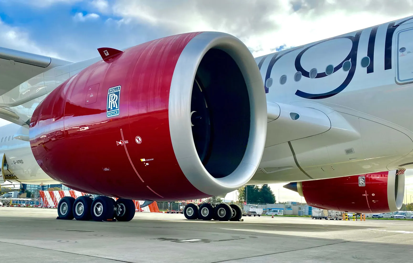 Close-up of a large aircraft engine on a commercial airplane at the airport.