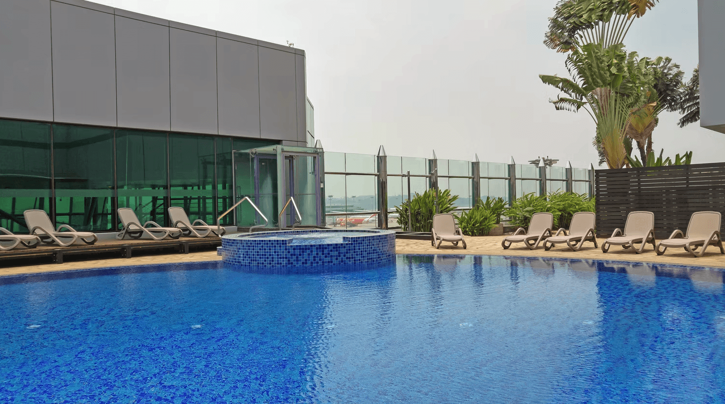 a living room with two recliners and a sink