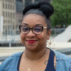 Possible member smiling and looking at the camera.