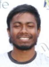 man in gray crew neck t-shirt and gray shorts sitting on basketball court