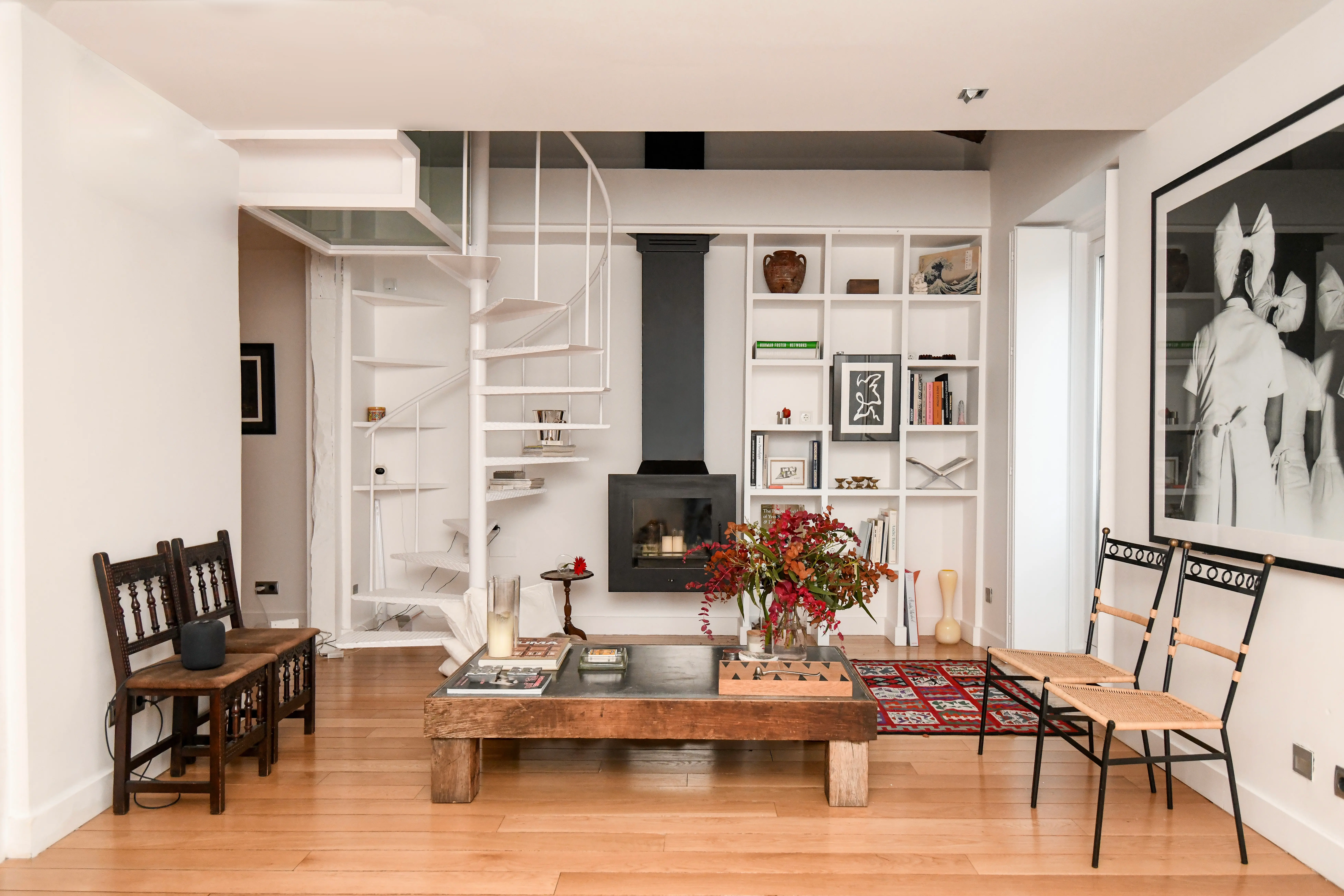 a chair sitting in front of an orange wall