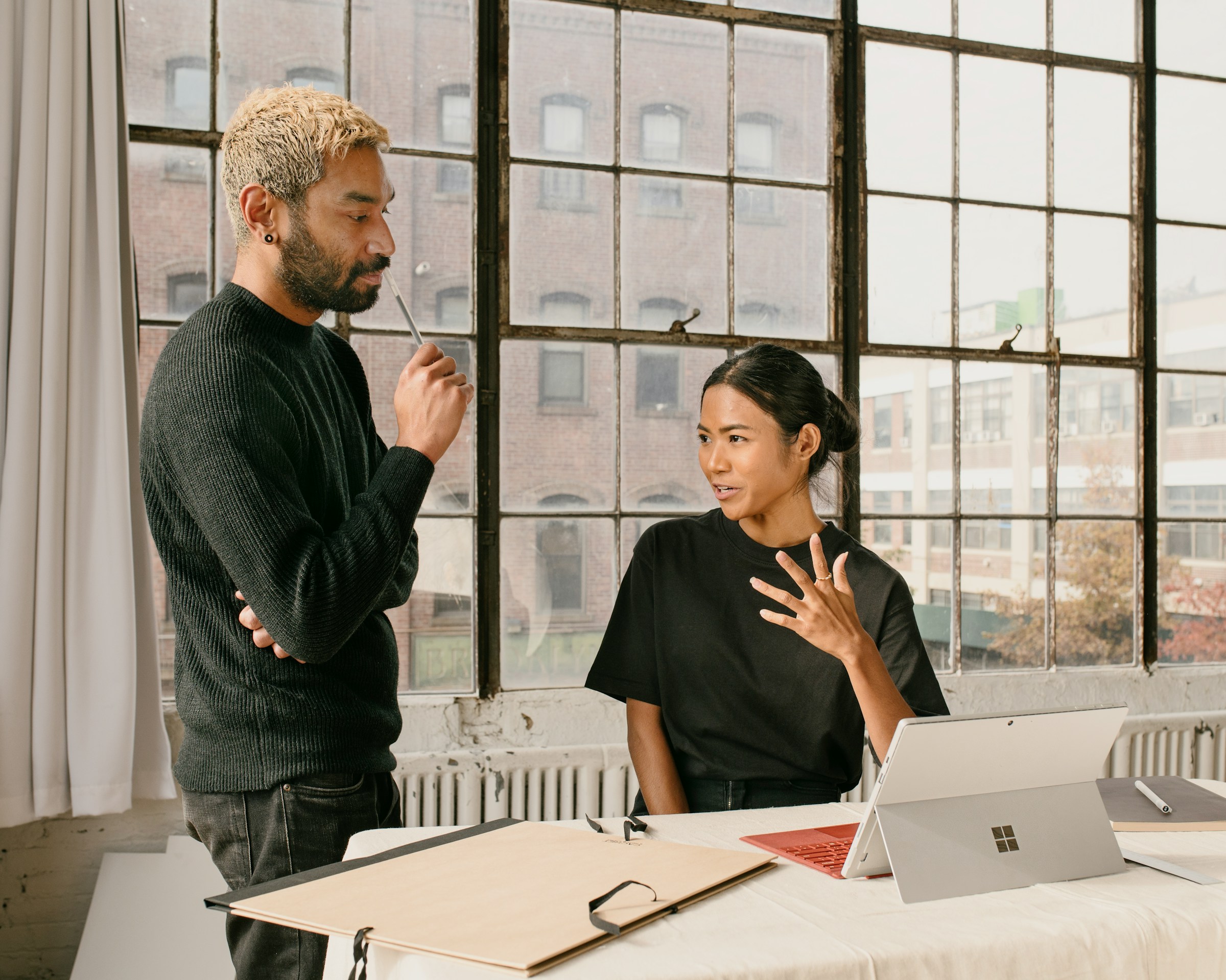 Two colleagues in a candid business conversation