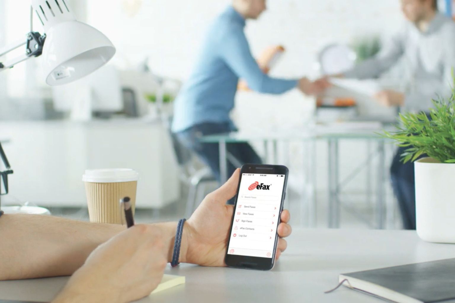 Person using eFax app on smartphone