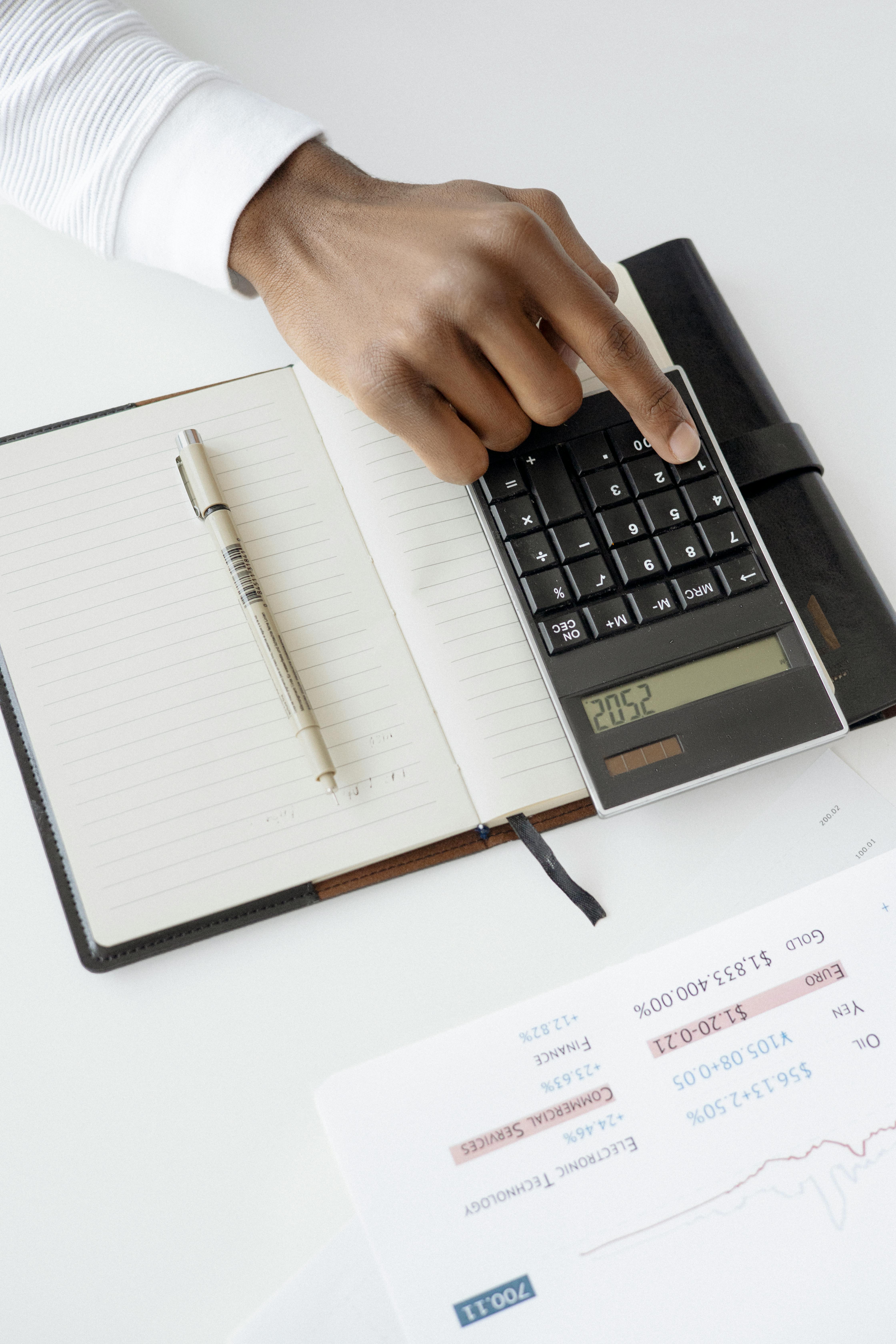 picture showing a person using calculator