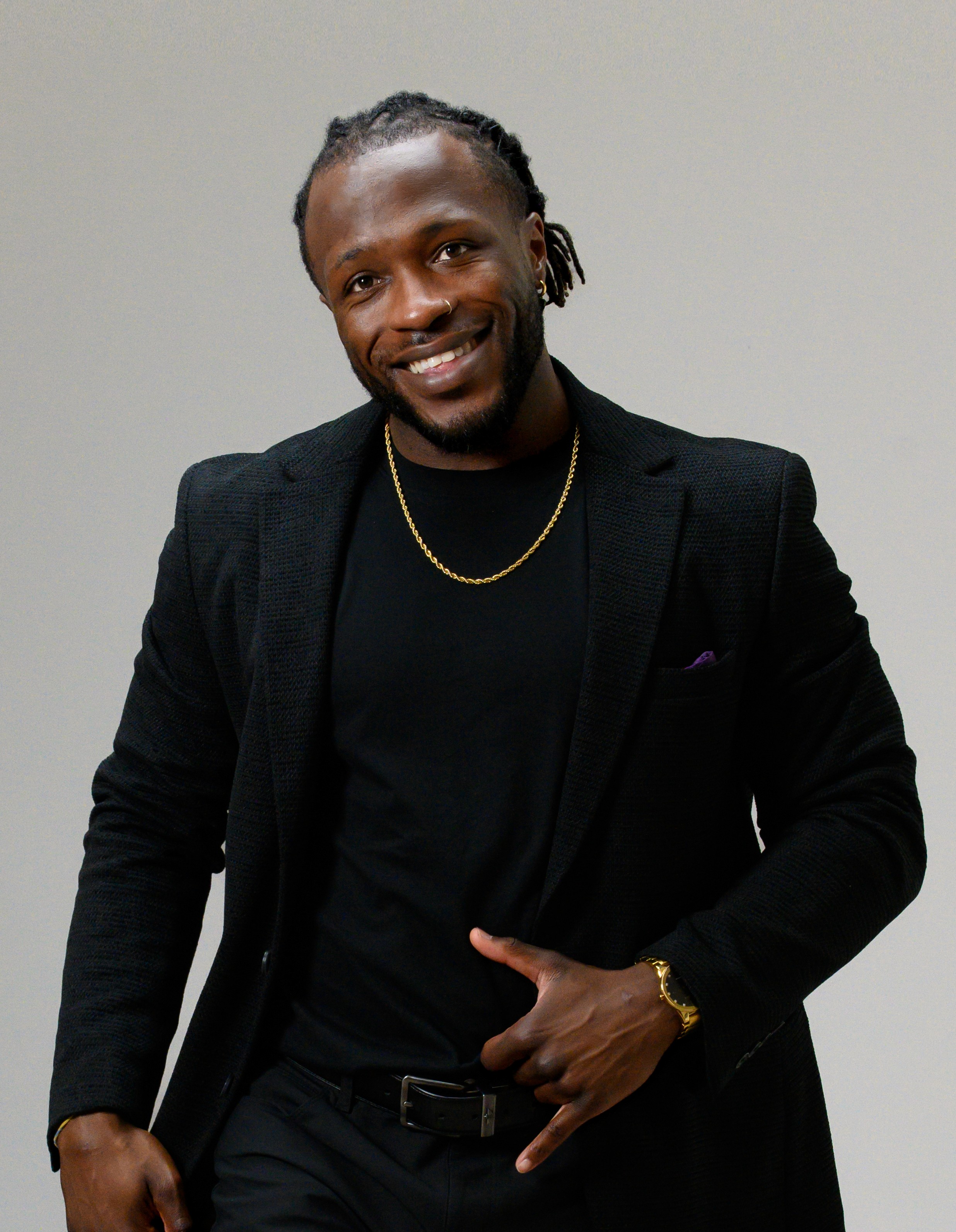 Strong man with muscles and tattoos smiling