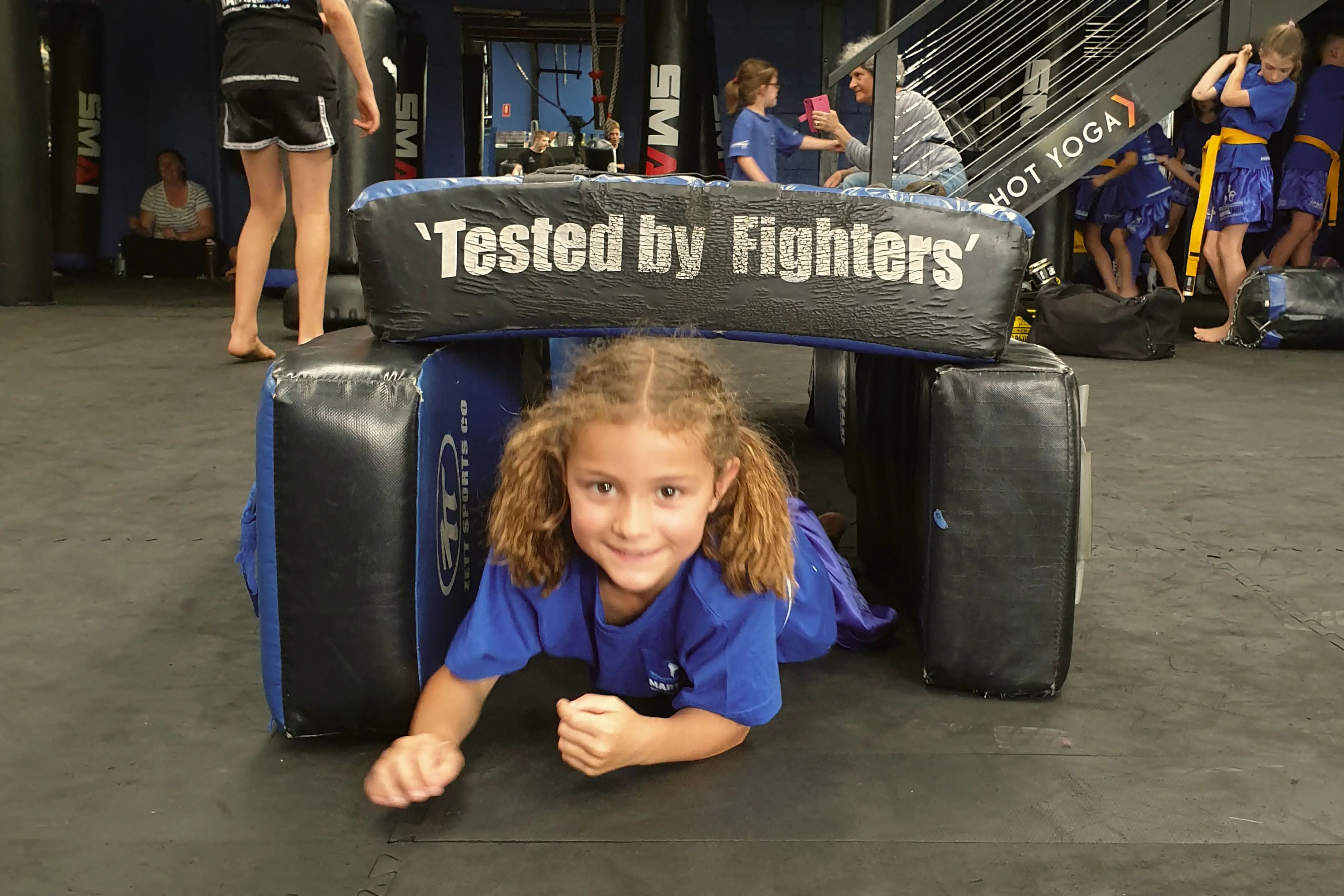 Young student in The Movement Zone kids martial arts class navigating an obstacle at Bomaderry gym