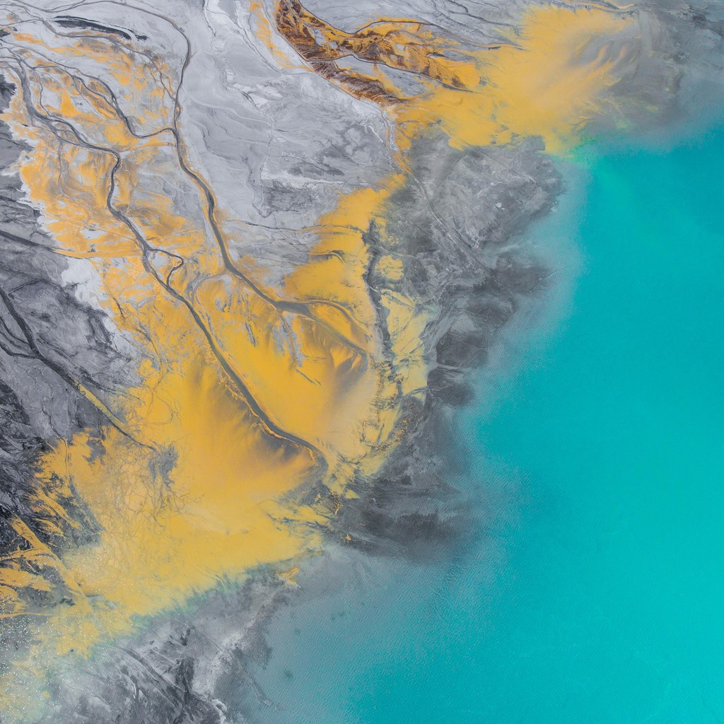 Aerial view of a large river delta flowing into a lake or ocean