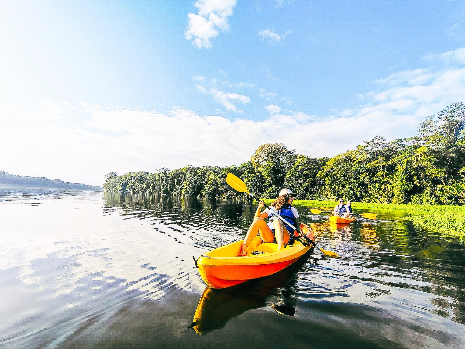 a couple of people standing on top of a mountain
