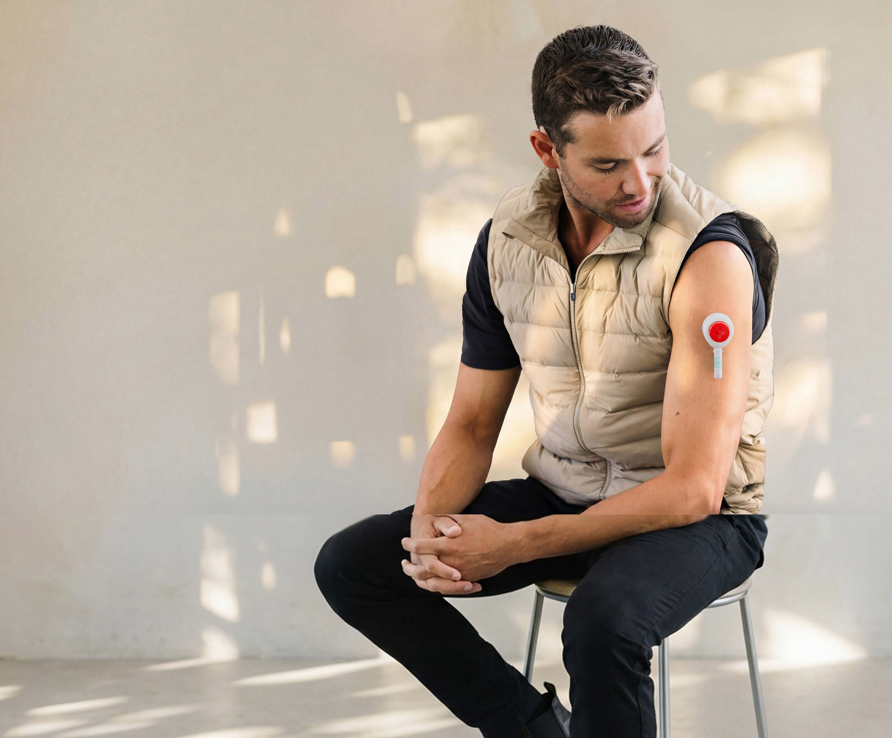 Man collecting a blood sample from his upper arm using an at-home test kit.