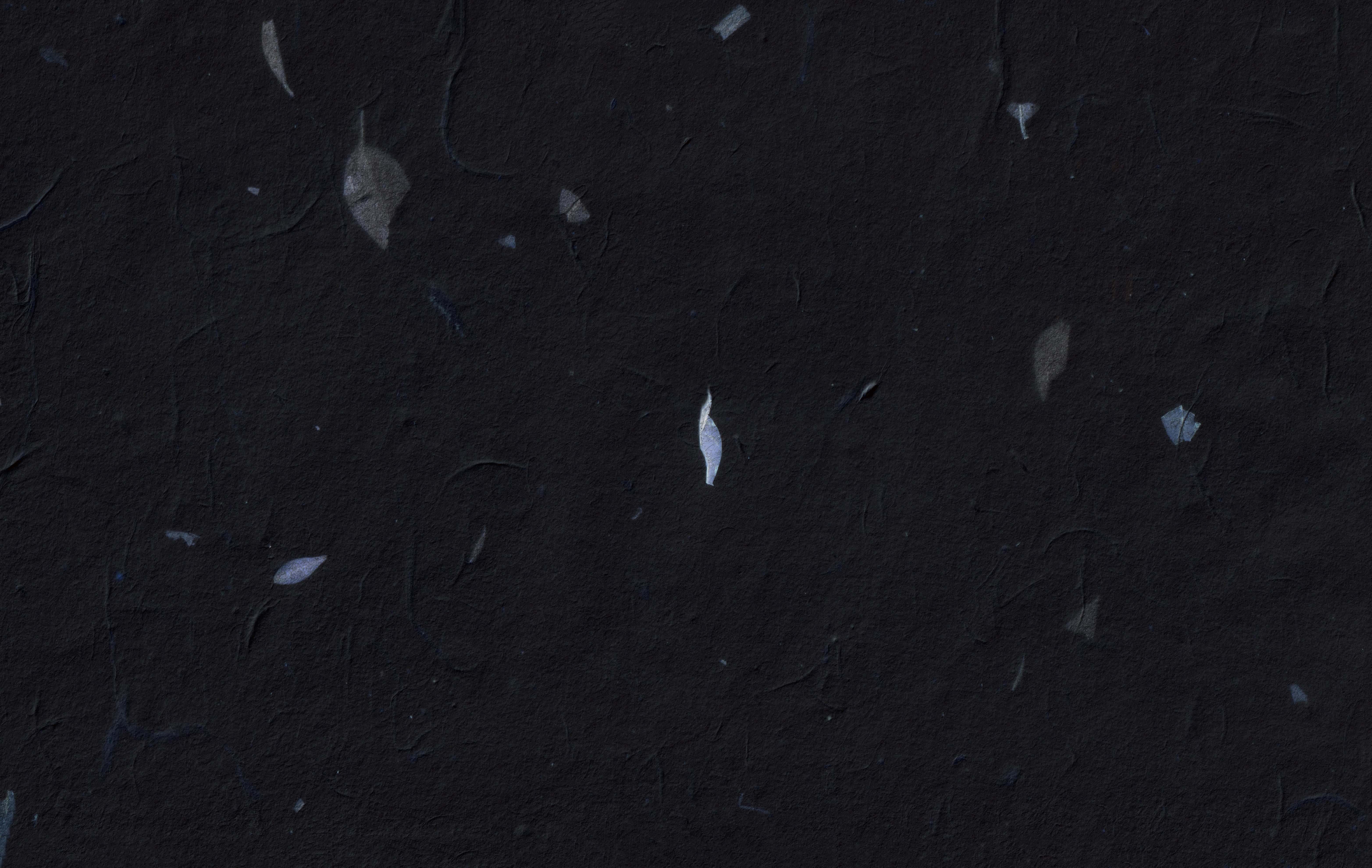 Dark textured background with scattered white specks