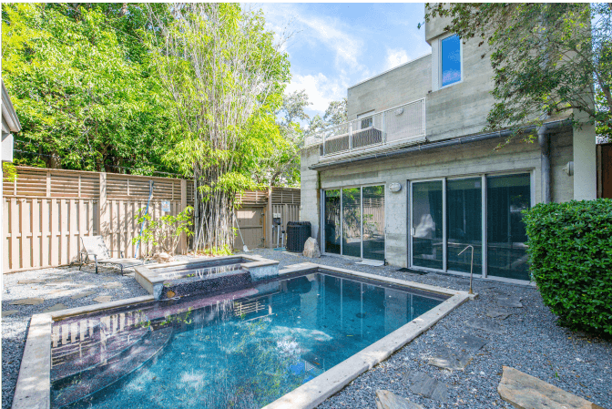 tranquil pool area surrounded by lush greenery—an exclusive Key West sanctuary for relaxation