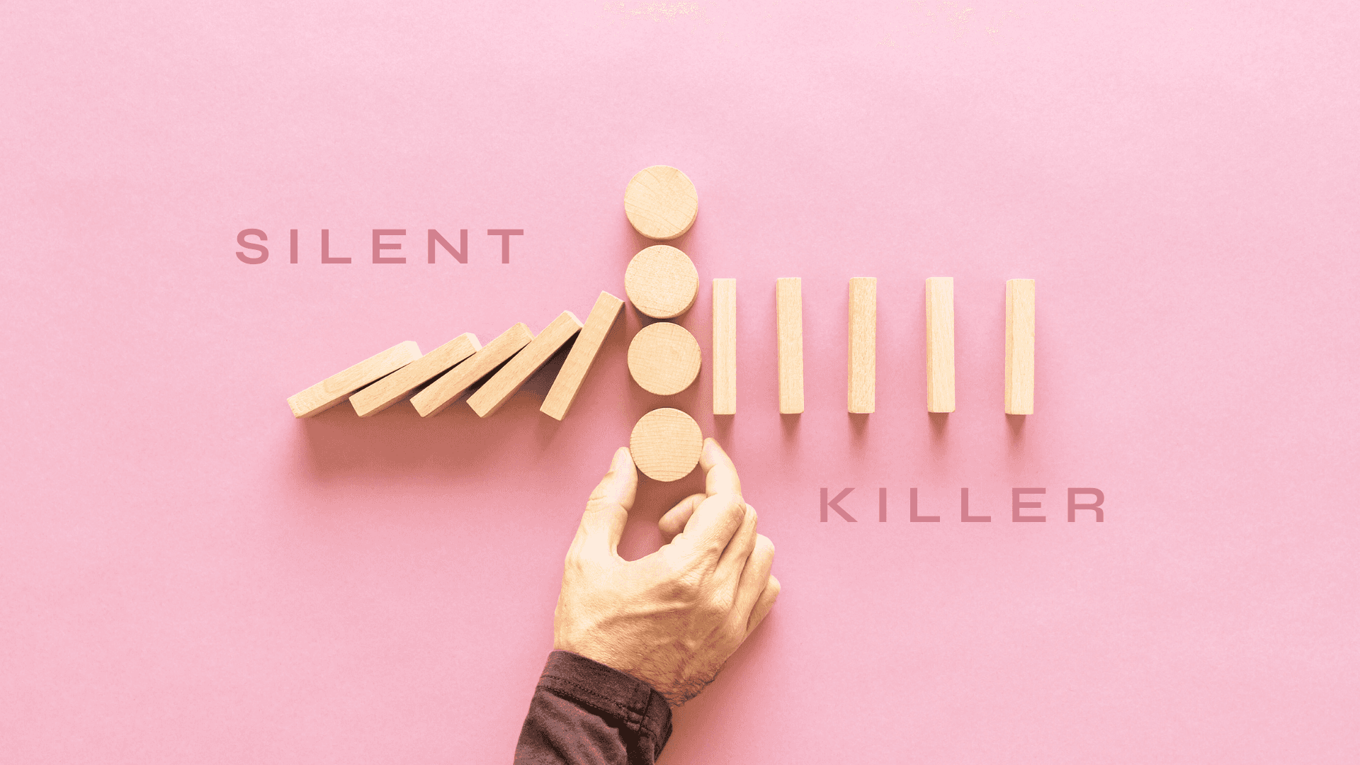 Hand blocking an elite performance process built with wooden blocks in pink background