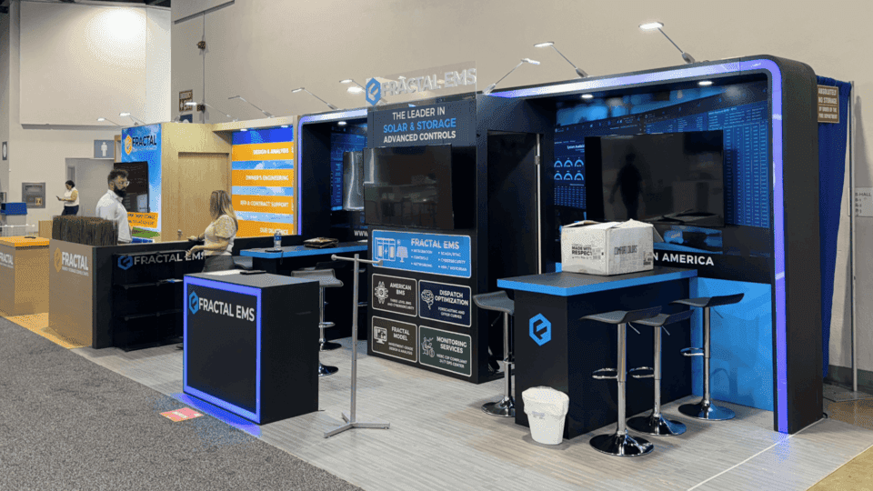 Solar and clean energy product booth with technical display graphics, product demo counter, and compact trade show booth layout