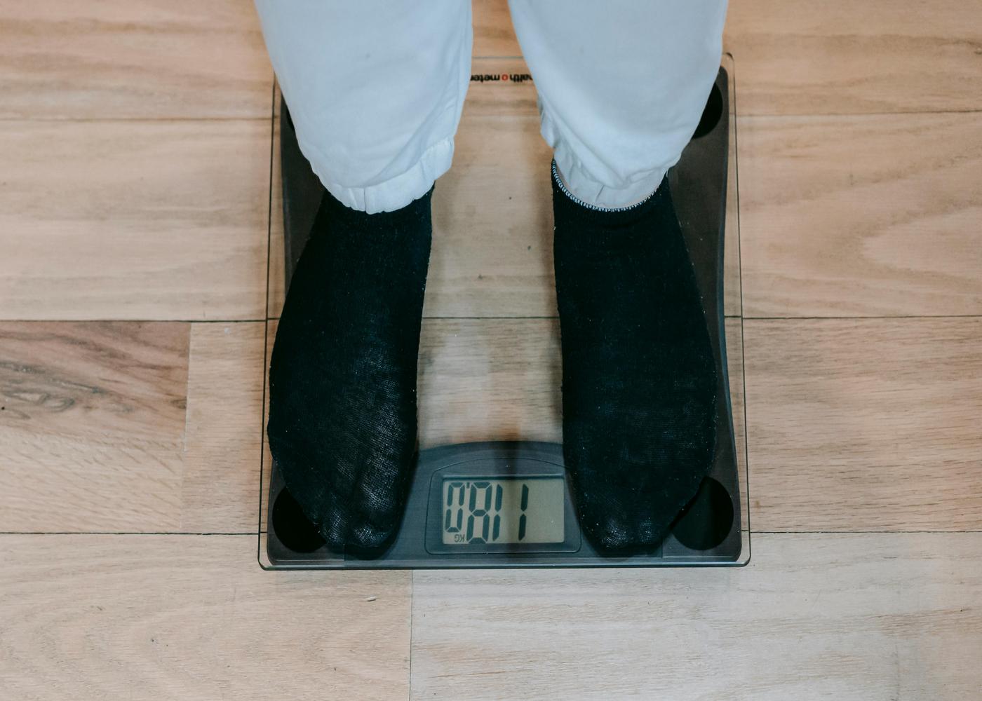 Person standing on weighing scales