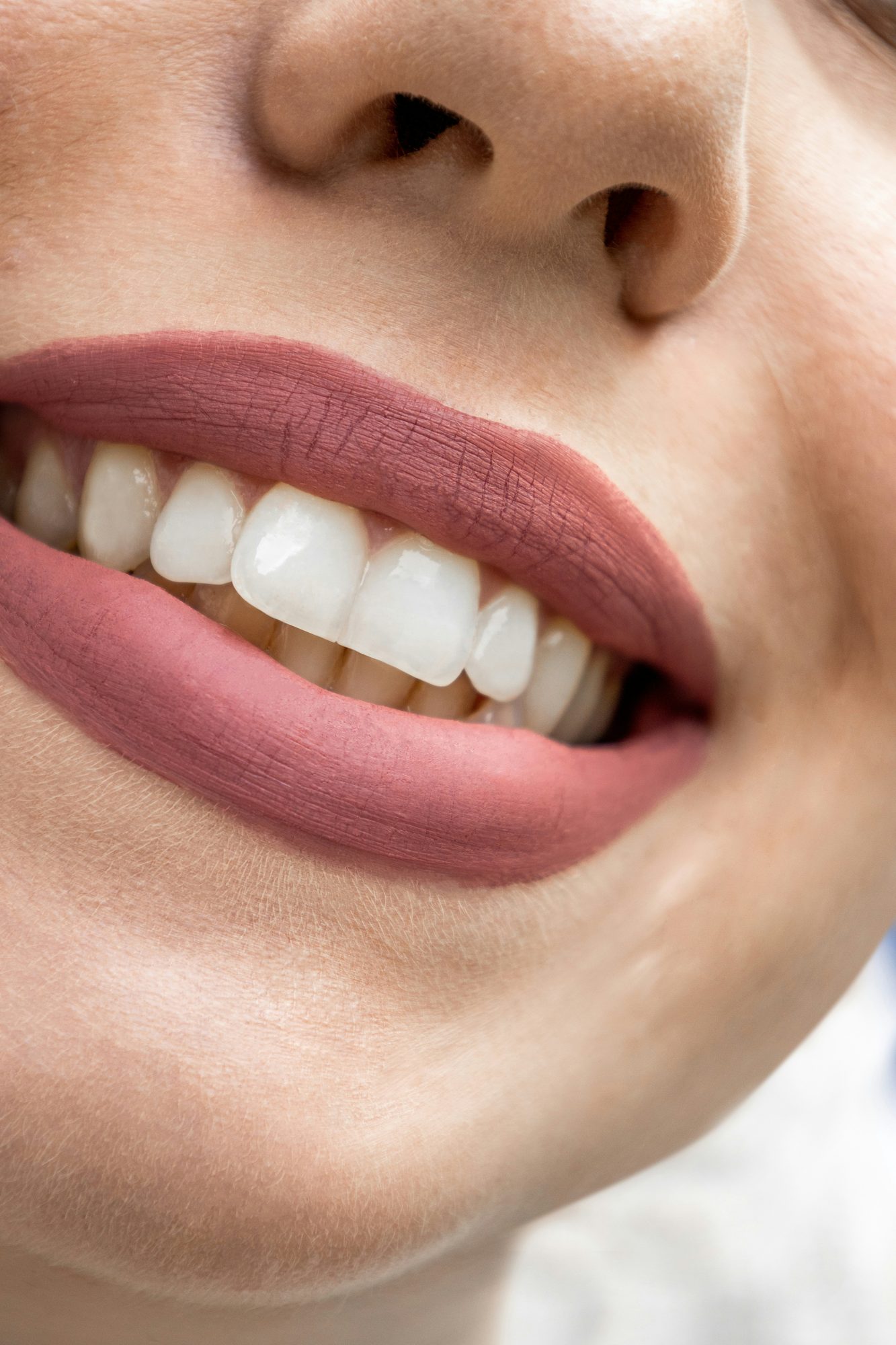 Close-up of a smiling woman's white teeth