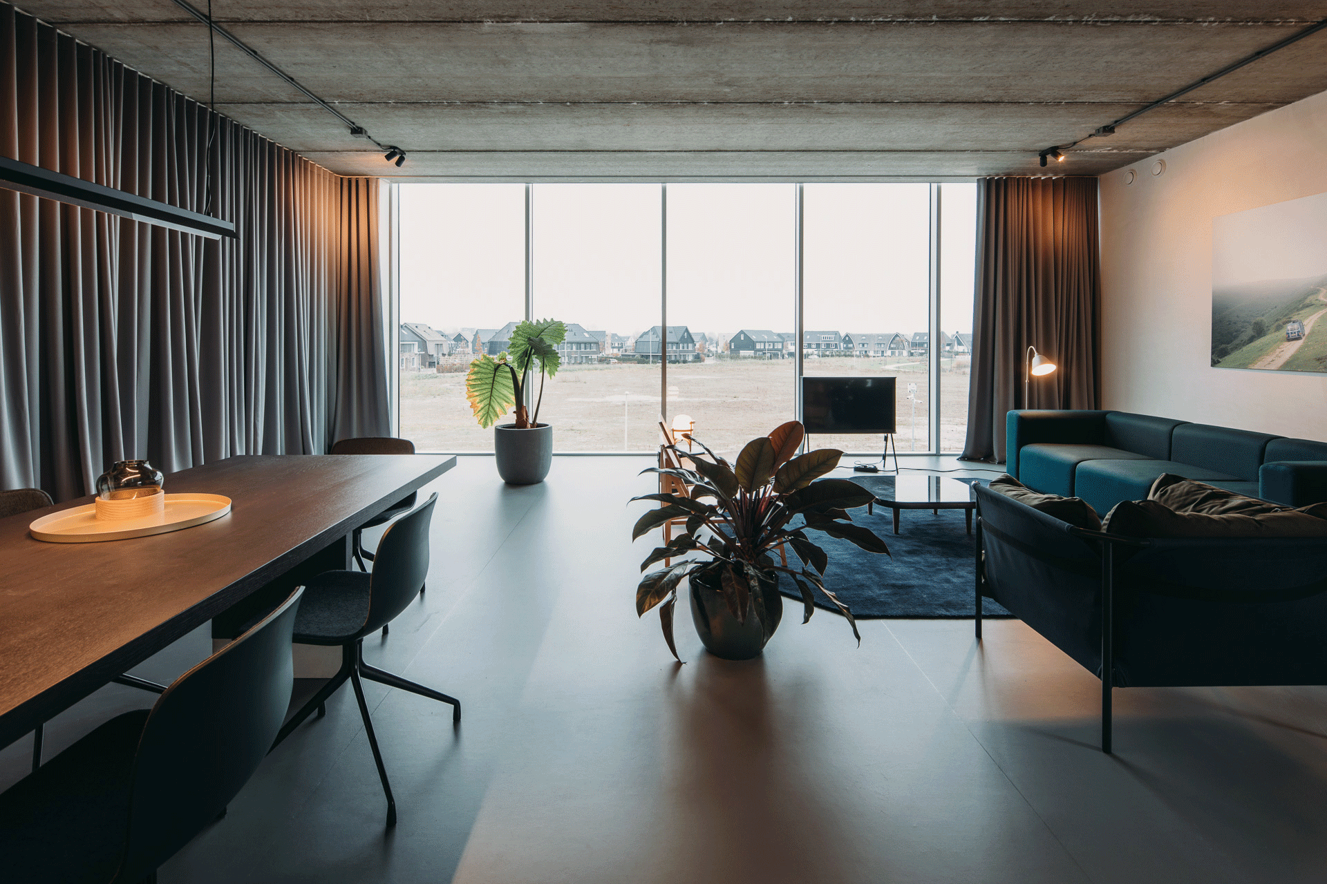 A gif with 4 interior photos of Wellwood office space, with several configurations of the large curtain