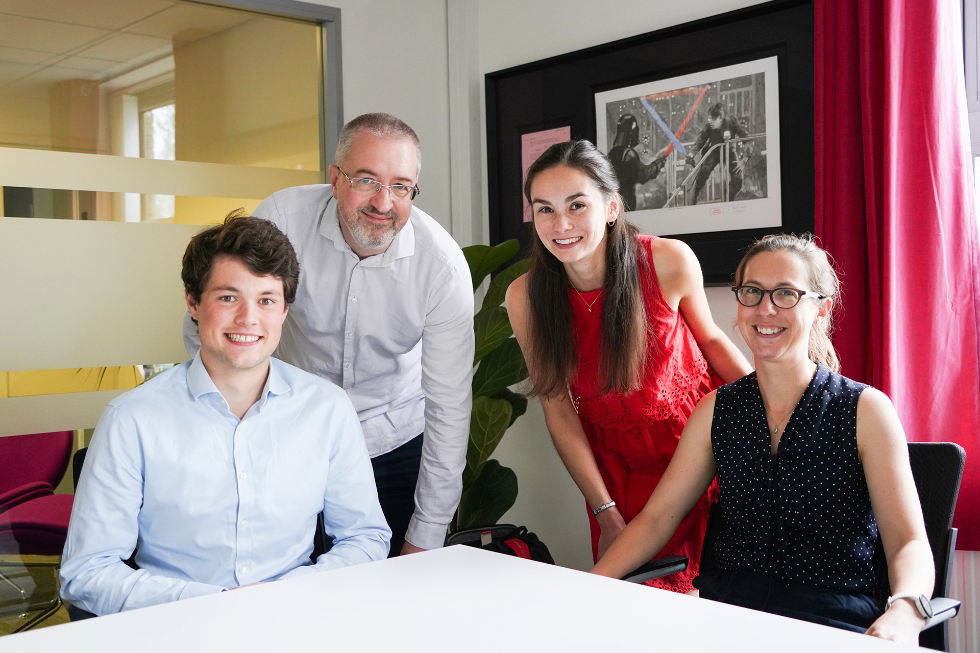 Hughes Price Walker Staff in a meeting smiling