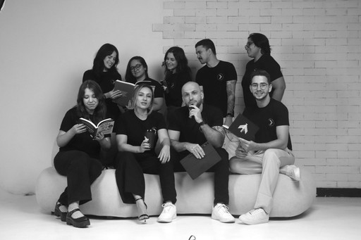 a man sitting in front of a laptop computer