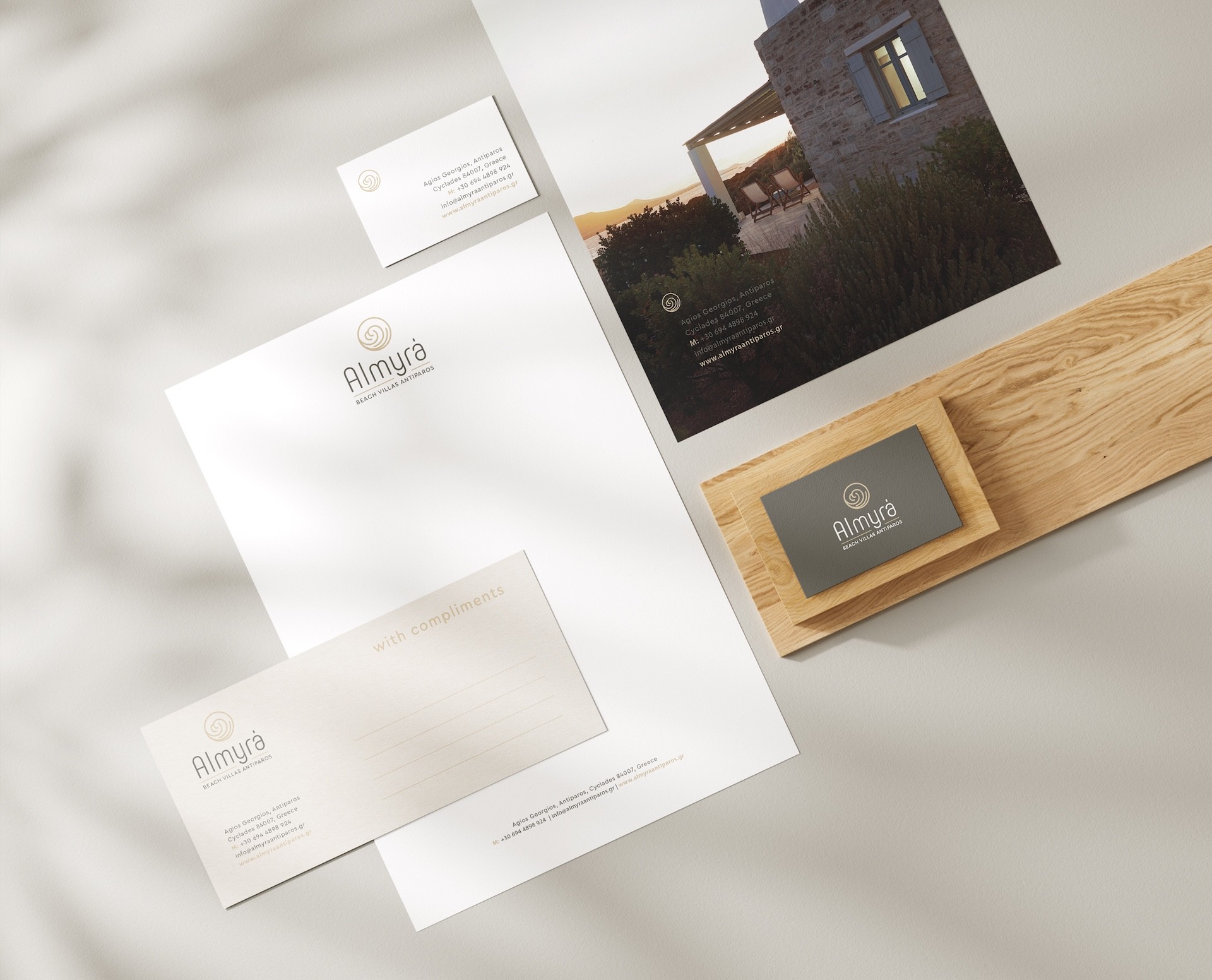 Almyra Antiparos brand identity applications including stationery, printed materials, and logo mockups