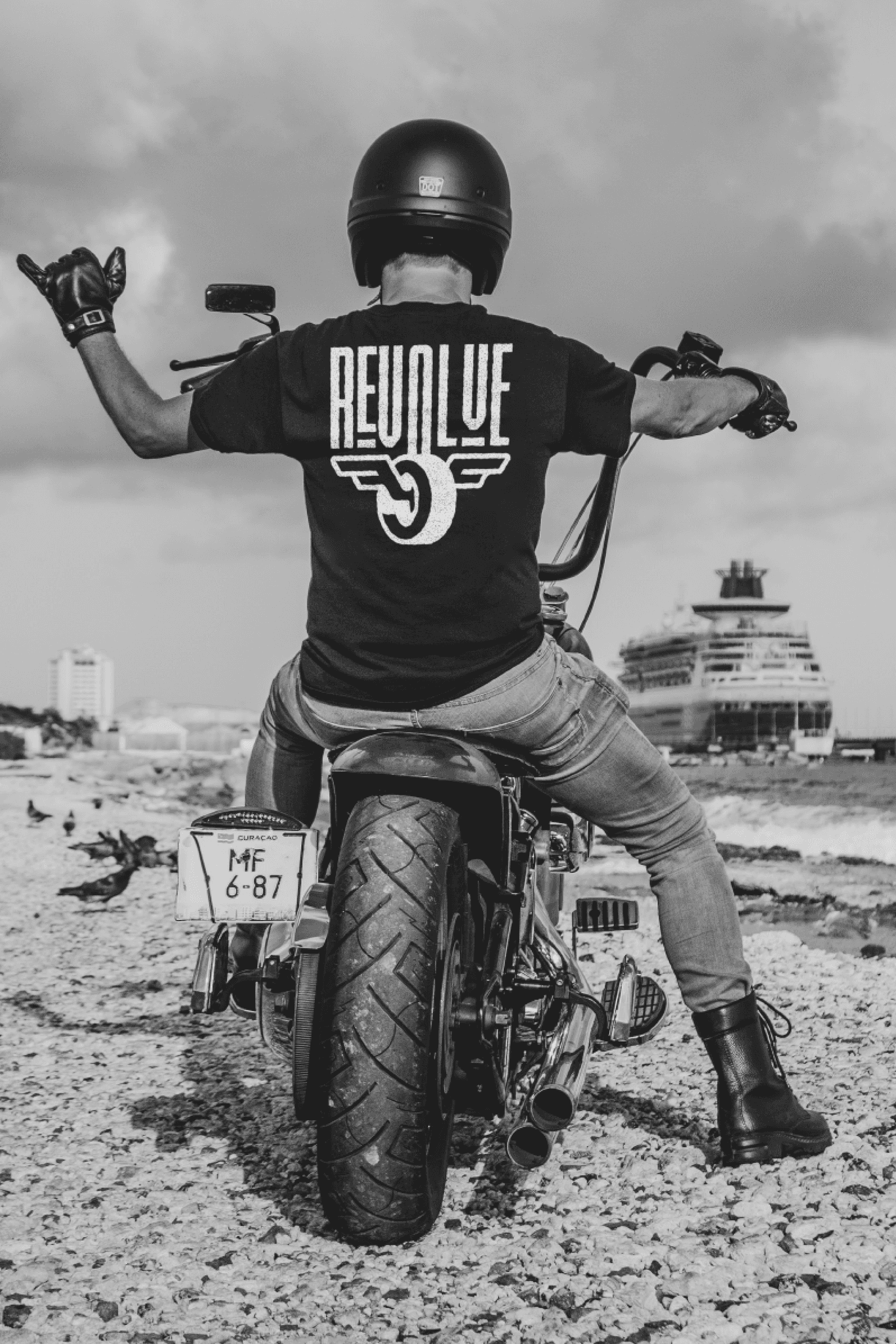 A biker wearing a Revolve Tee