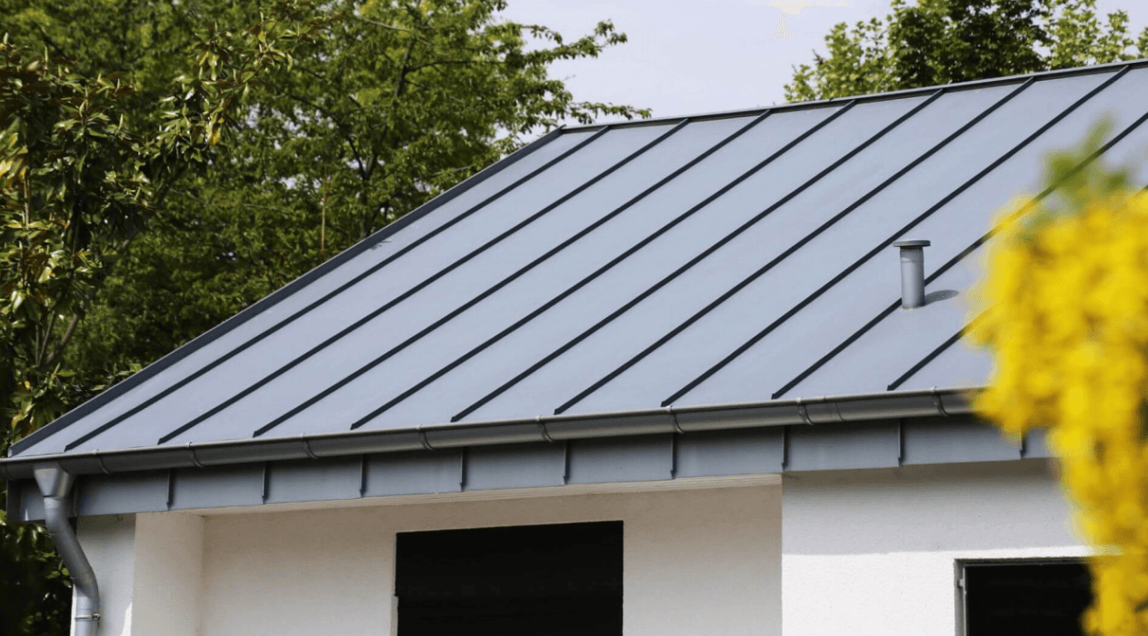 a man in a yellow shirt is working on a roof