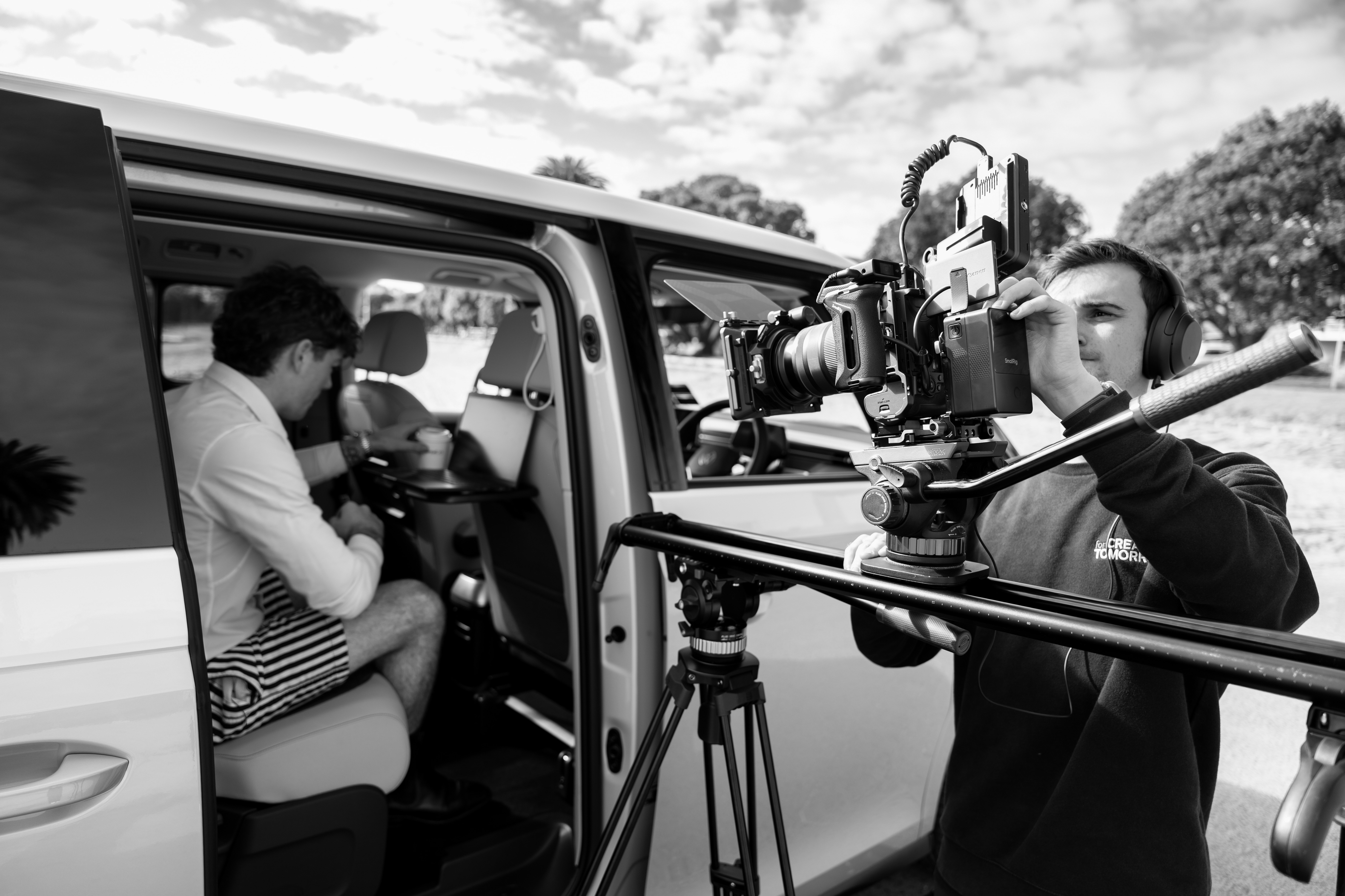 Streetside billboard with flyposters of the Batch.Works brand and illustrations