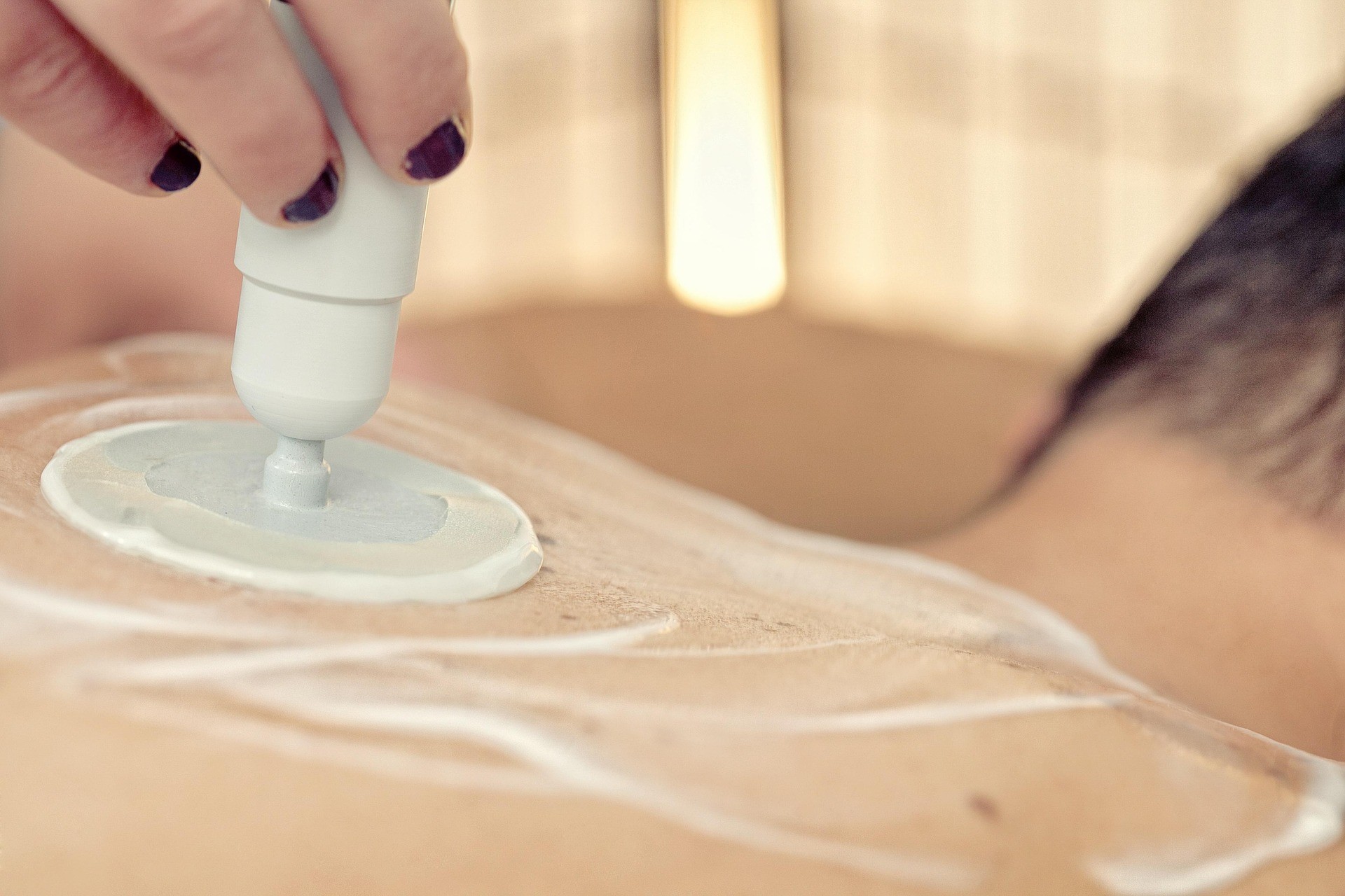Futuristic glass tablet displaying a glowing blueprint-like interface against a dark background. It conveys a sleek, modern, and high-tech aesthetic.