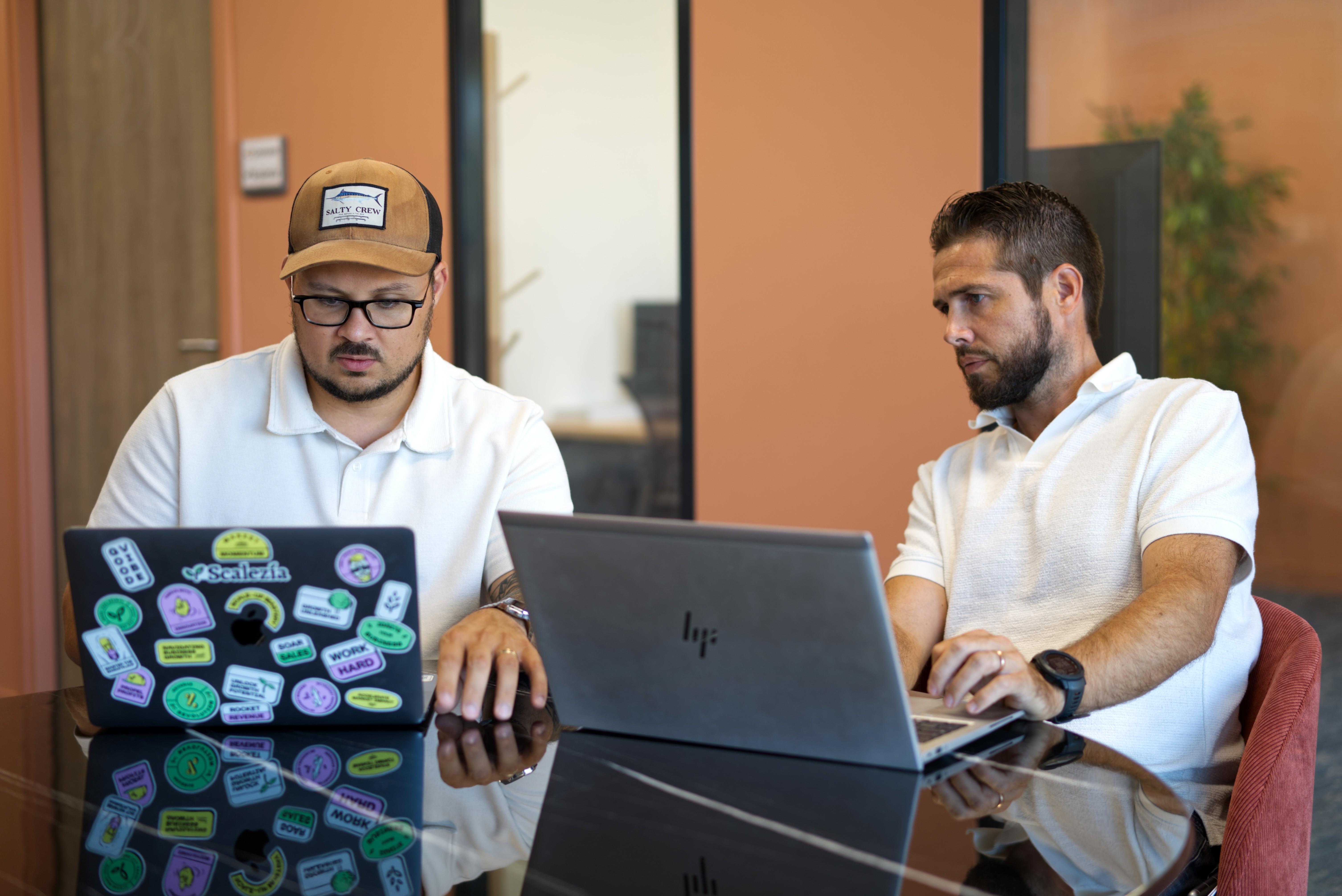 The girl works at home on a laptop