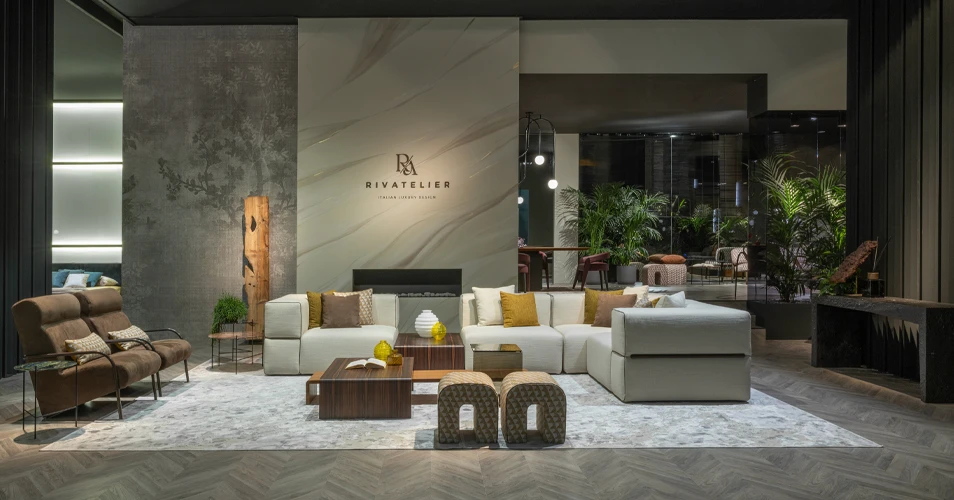 Luxury outdoor living room furniture featuring three armchairs and two tables by the swimming pool.