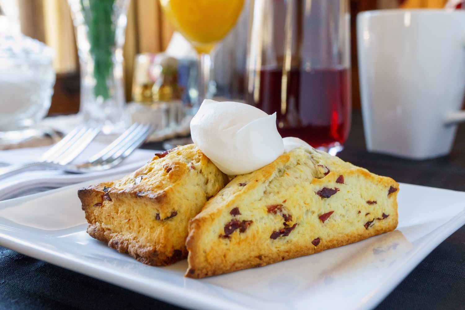 nfinity pool blending into the ocean view, minimalist sun loungers in soft neutral fabric, curved architecture