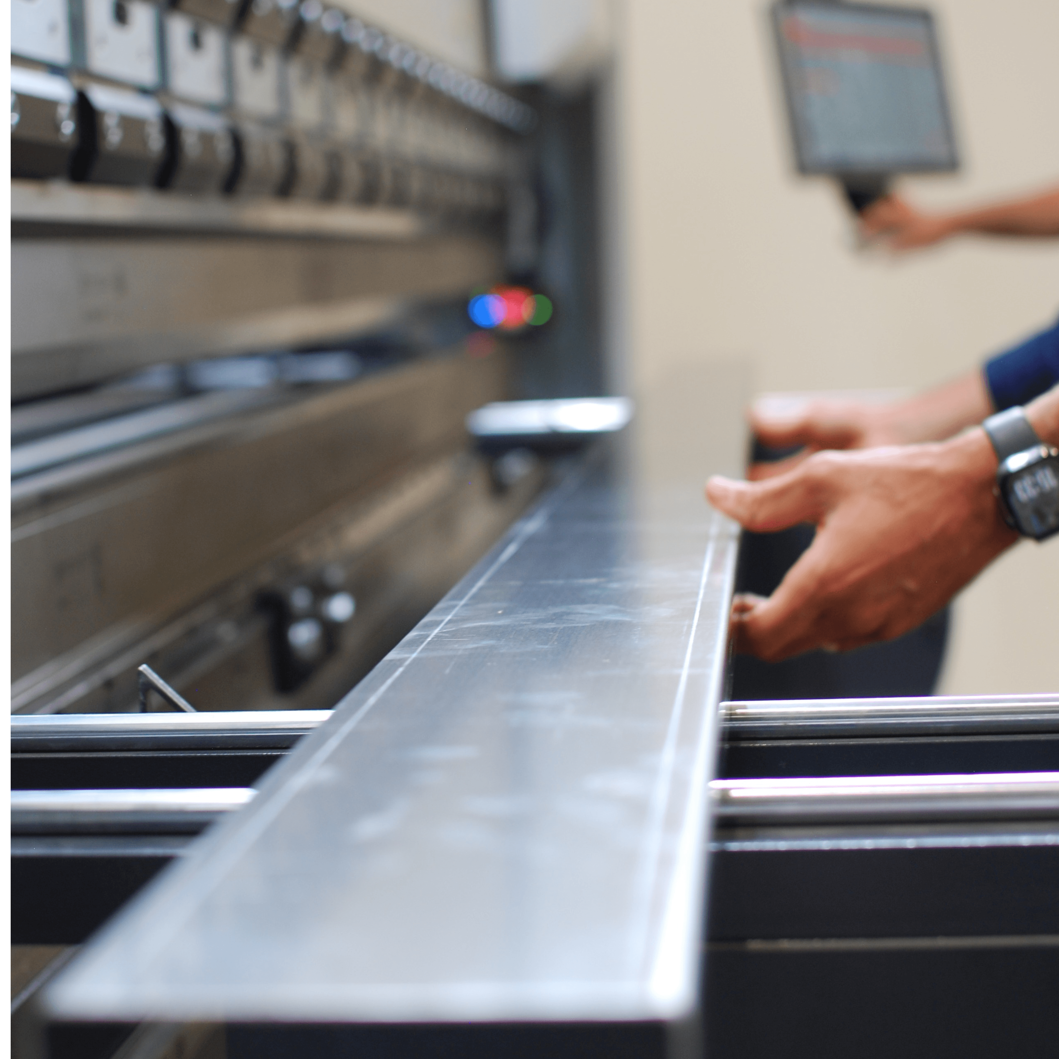 welder working on a piece of metal in a factory