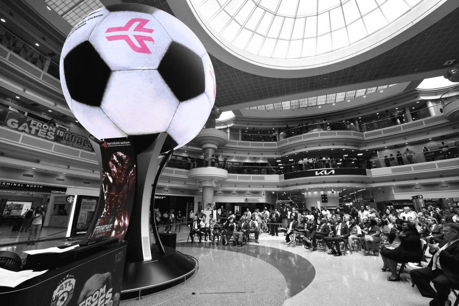 A photo of the ATLAS Sphere at ATL, with content playing to make it look like a football