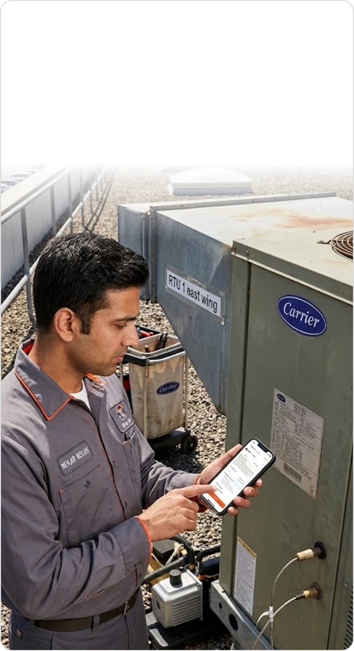 HVAC technician photographing an equipment nameplate with a smartphone