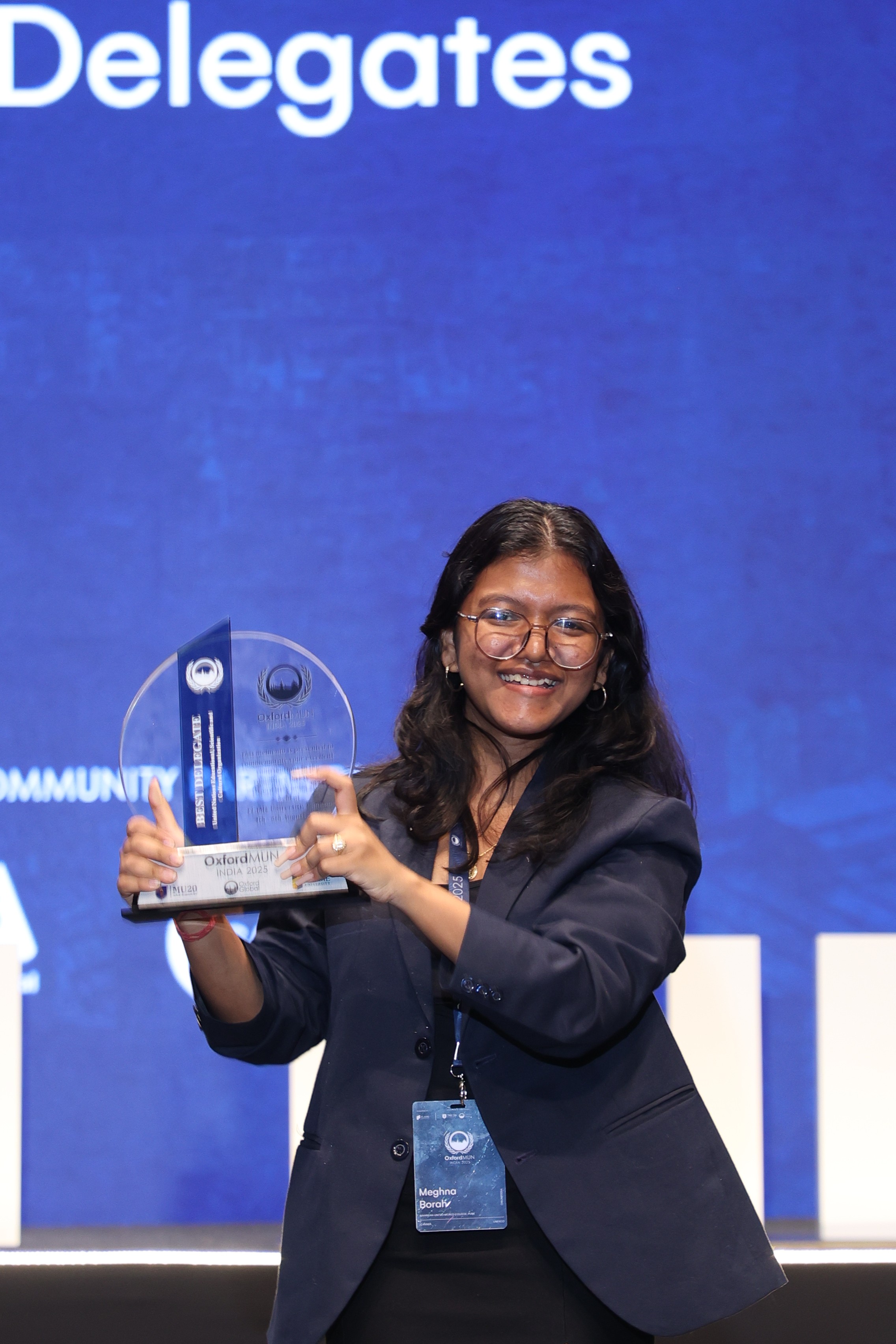 A man stading with Surfboard