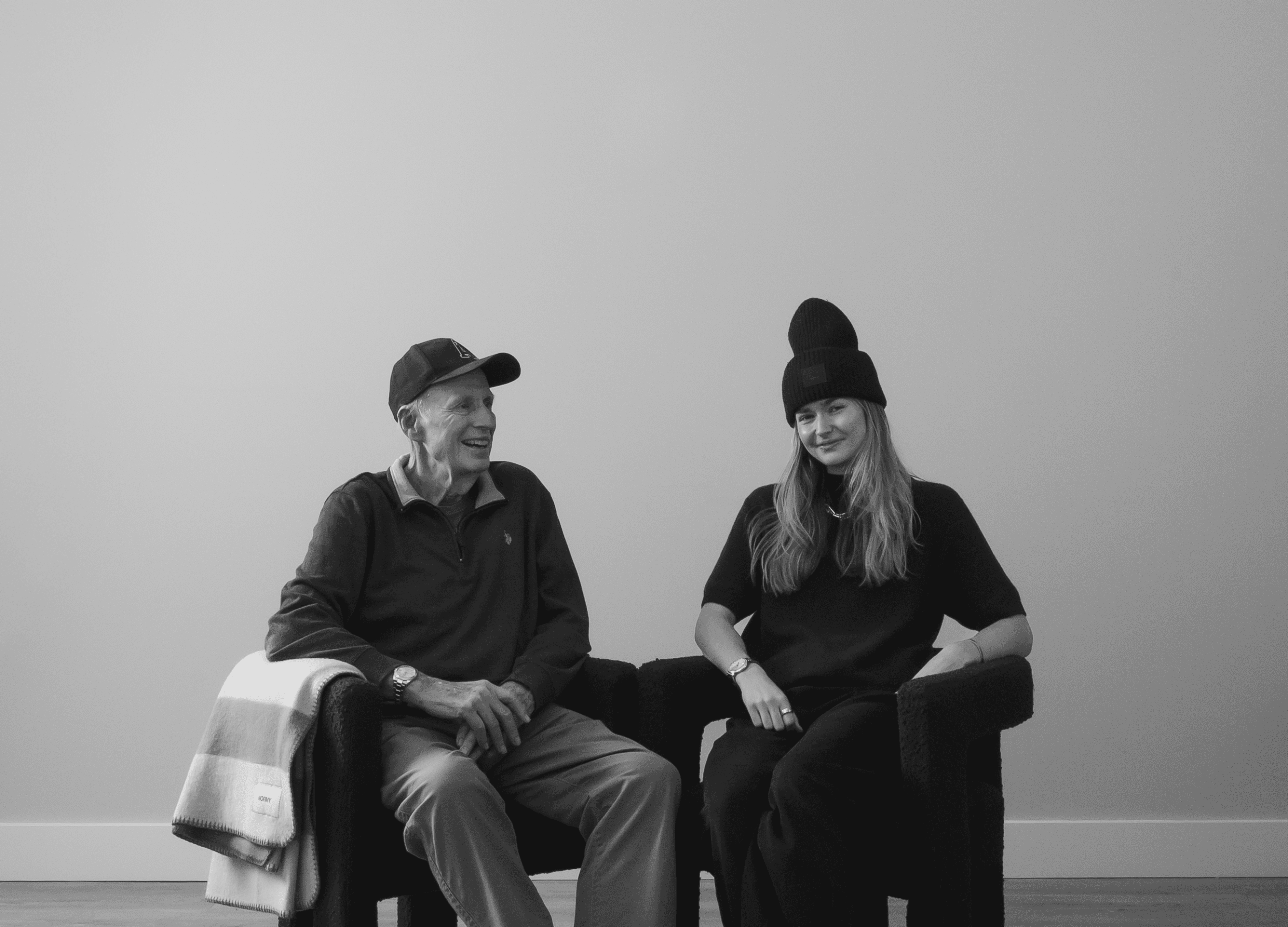 Alex McIntyre, the founder of Normy, stands with his grandfather Norman McIntyre, who inspired the creation of the Normy Blanket brand. The image reflects the generational connection and legacy at the heart of the company's story.