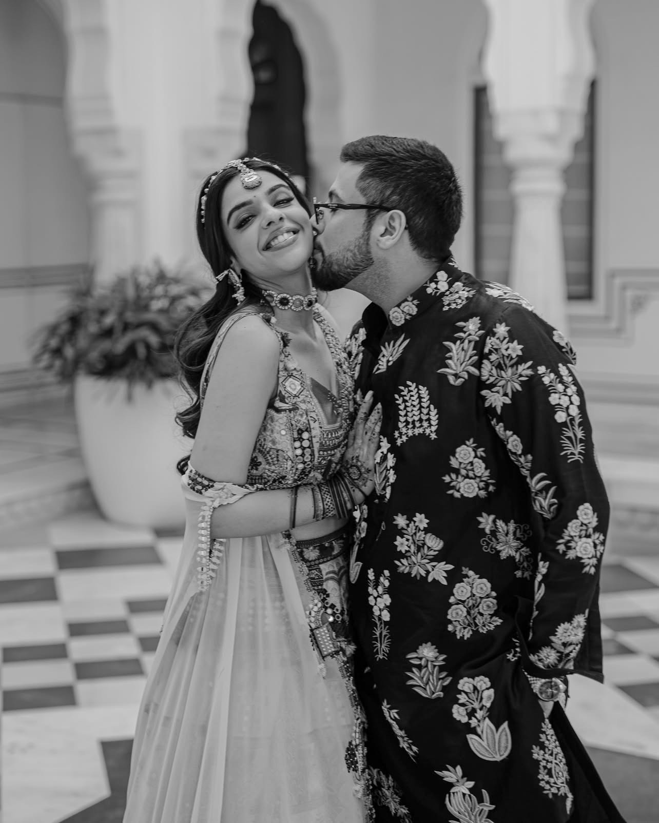 newly wedded couple standing on shore during daytime
