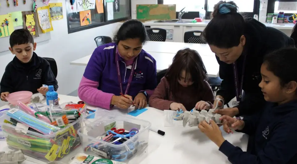 Educators creating art with students.