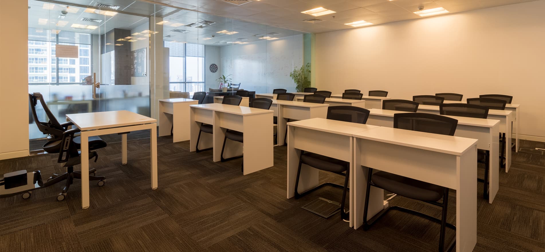 A modern, warm-lit workspace at myOffice, ideal for workshops, training sessions, and collaborative activities.