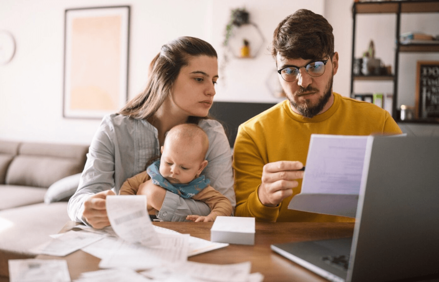 couple doing paperwork and computing taxes