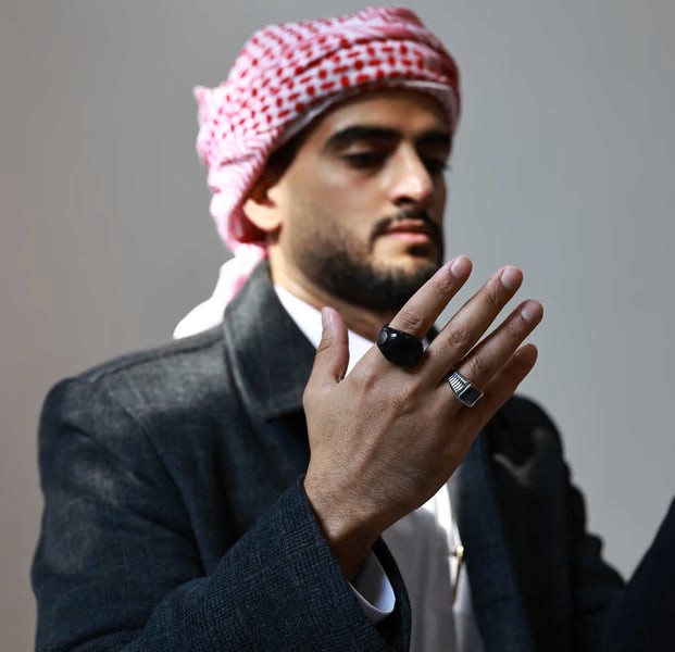 Close-up of WESLAMIC iTasbih waterproof smart dhikr ring during wudu