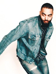 A photo of a man wearing a blue jeans and jacket.