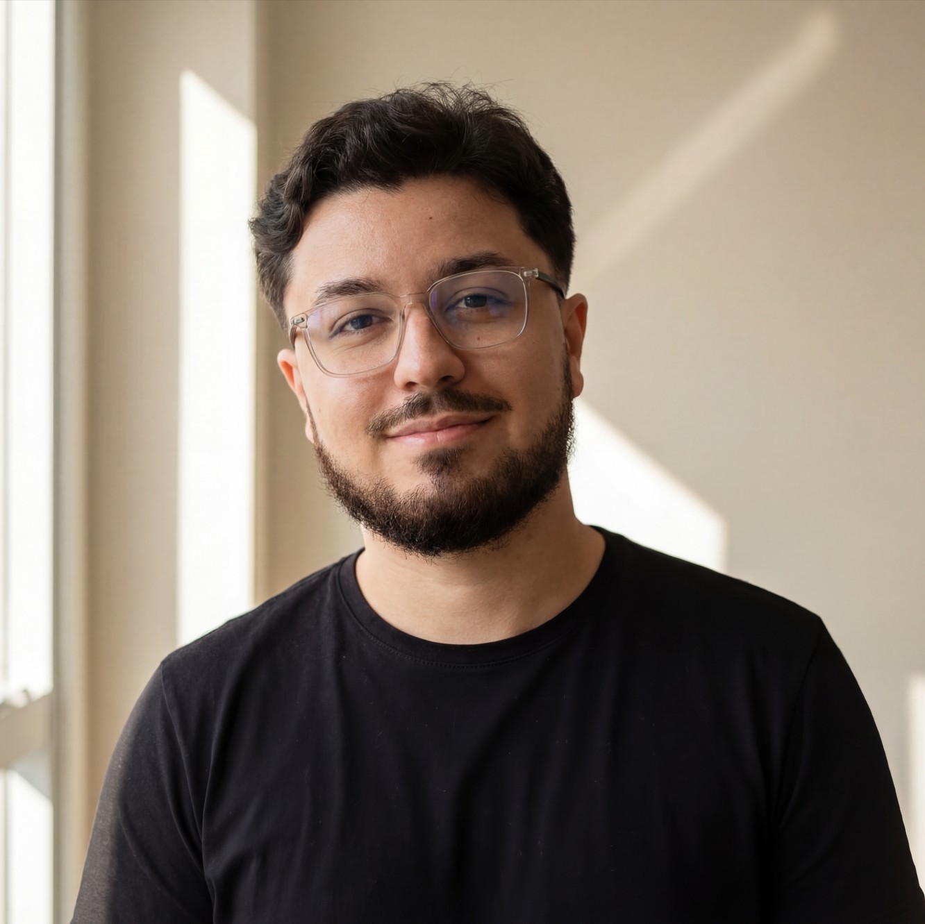 A person in a winter coat and furry hat walking along a snow-covered path through a forest of frosted trees.
