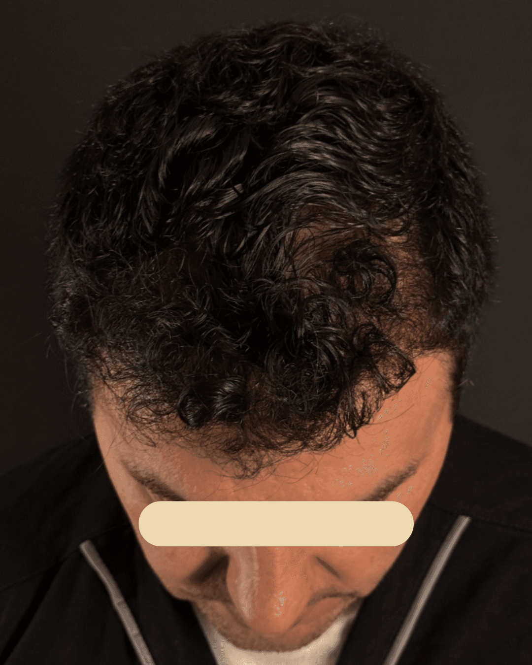 man standing beside wall