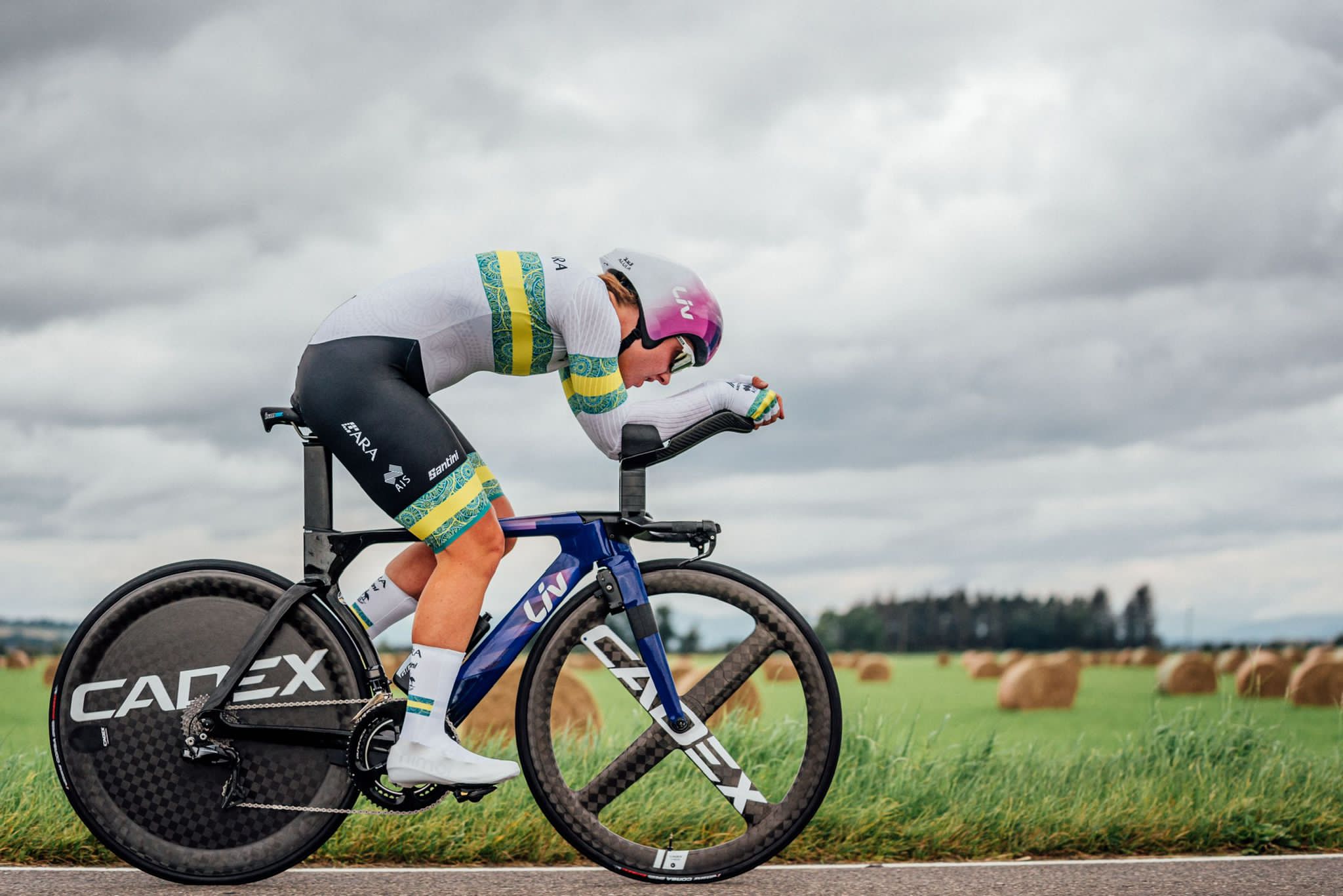 Professional Cyclist cycling along roadside